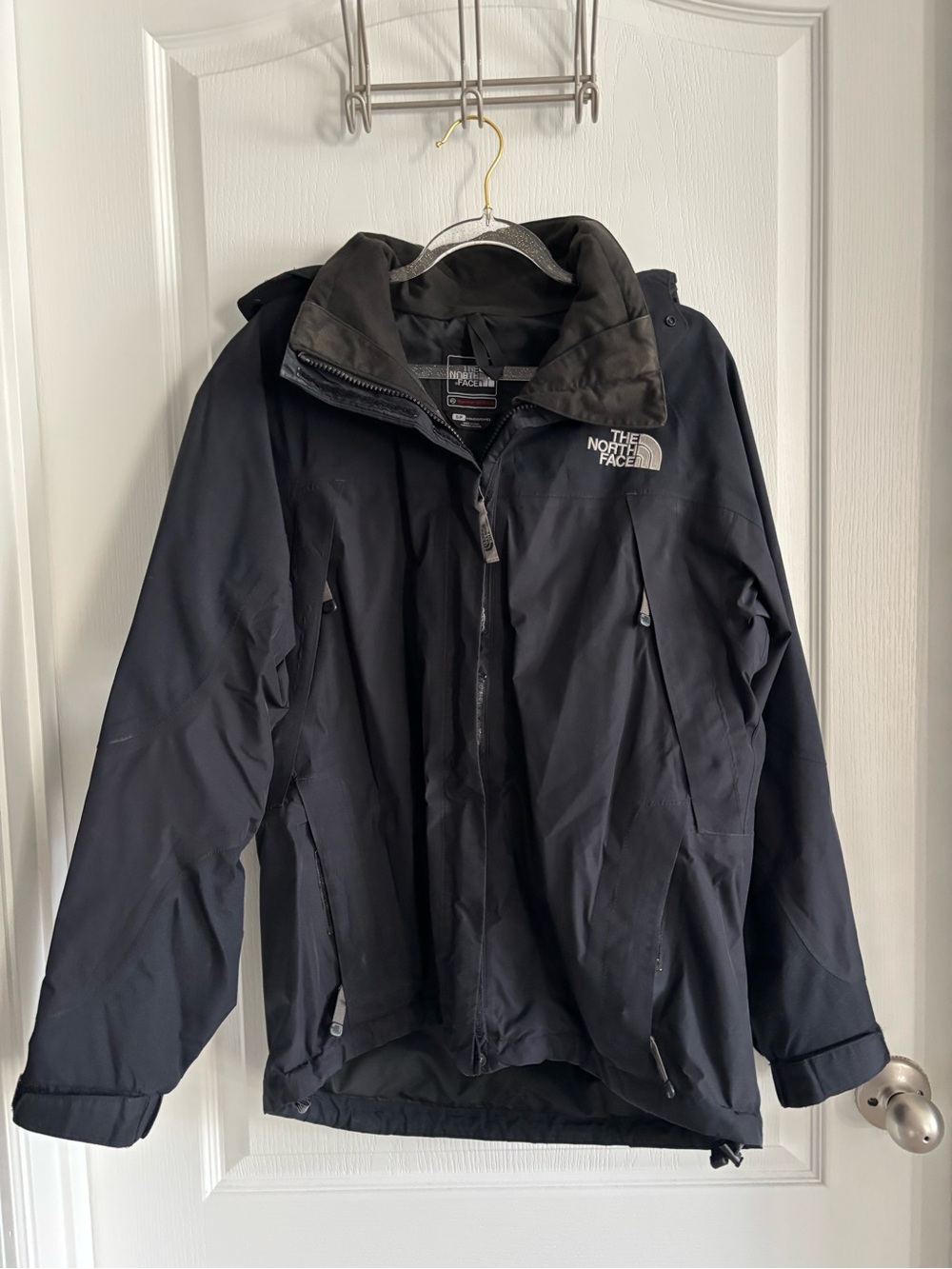 The North Face Navy Blue Shell Jacket with White Logo